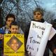 People display signs during a rally Nov. 24, 2014, at Cudell Commons Park in Cleveland for Tamir Rice, a 12-year-old boy fatally shot by police in the park Nov. 22, 2014.
JORDAN GONZALEZ/AFP/Getty Images
